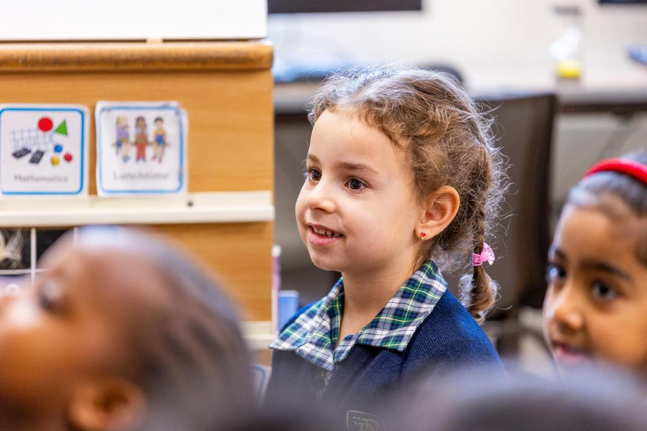 A child listening attentively in class