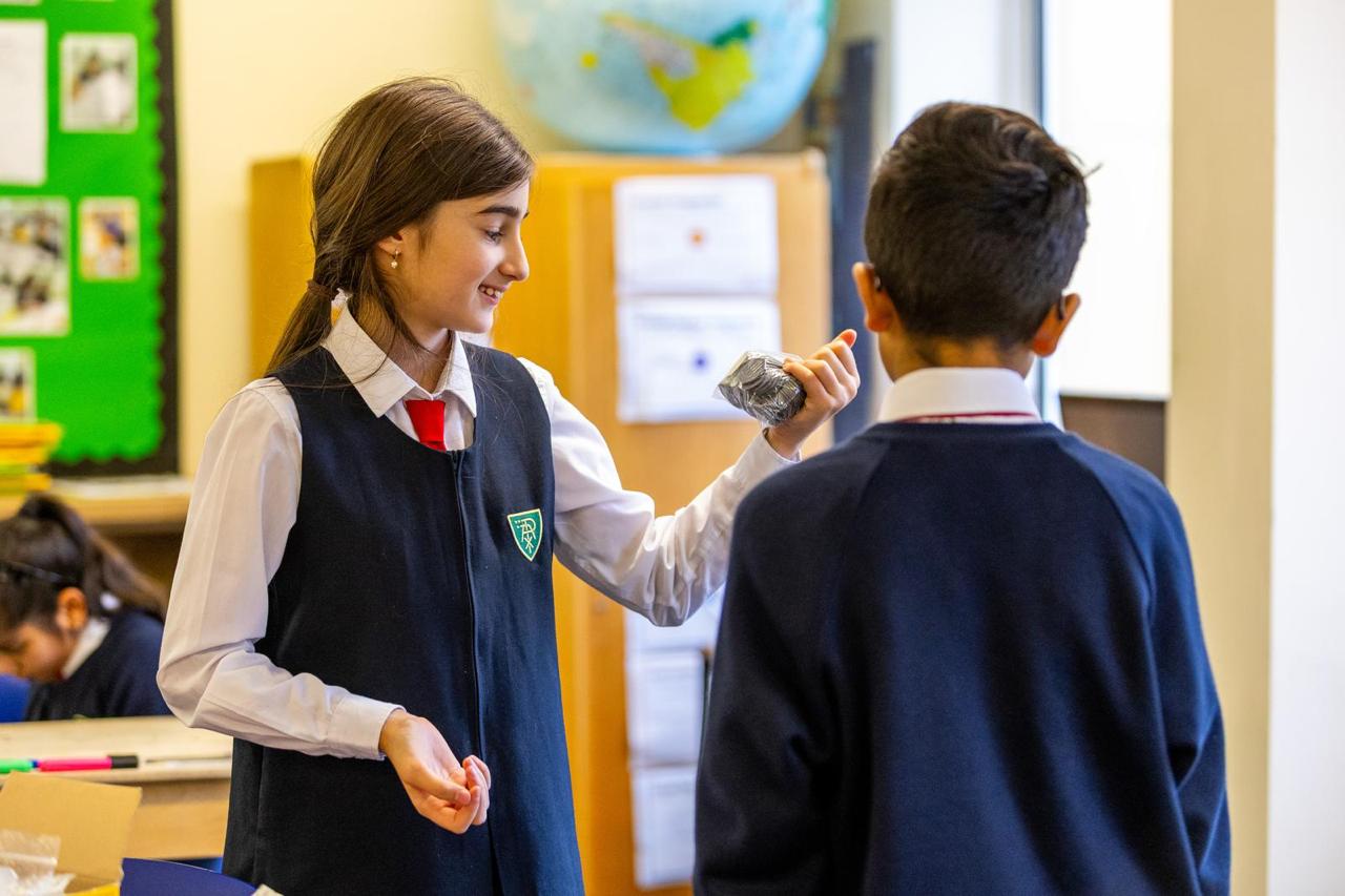 Two Vita et Pax prep pupils working together in class, Southgate, North London