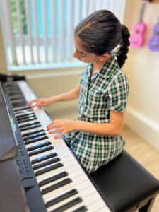 student playing the piano
