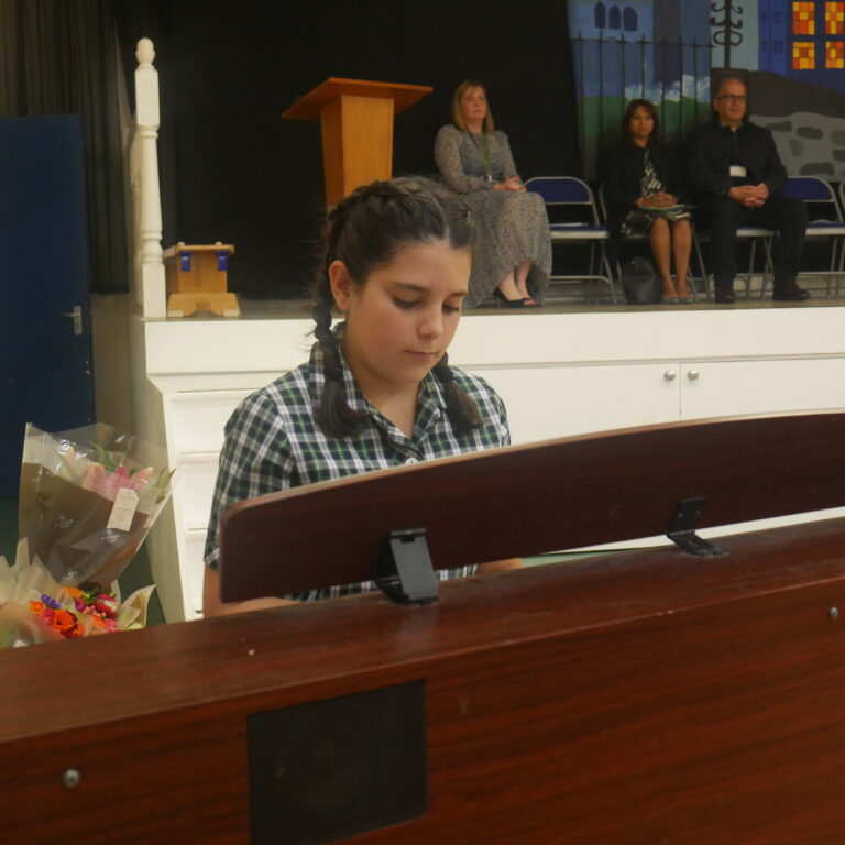 student playing the piano